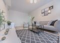 Three Gray Ornaments on White Wooden Desk Inside Living Room