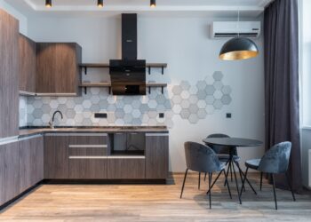 Modern kitchen interior with furniture and lamp at home